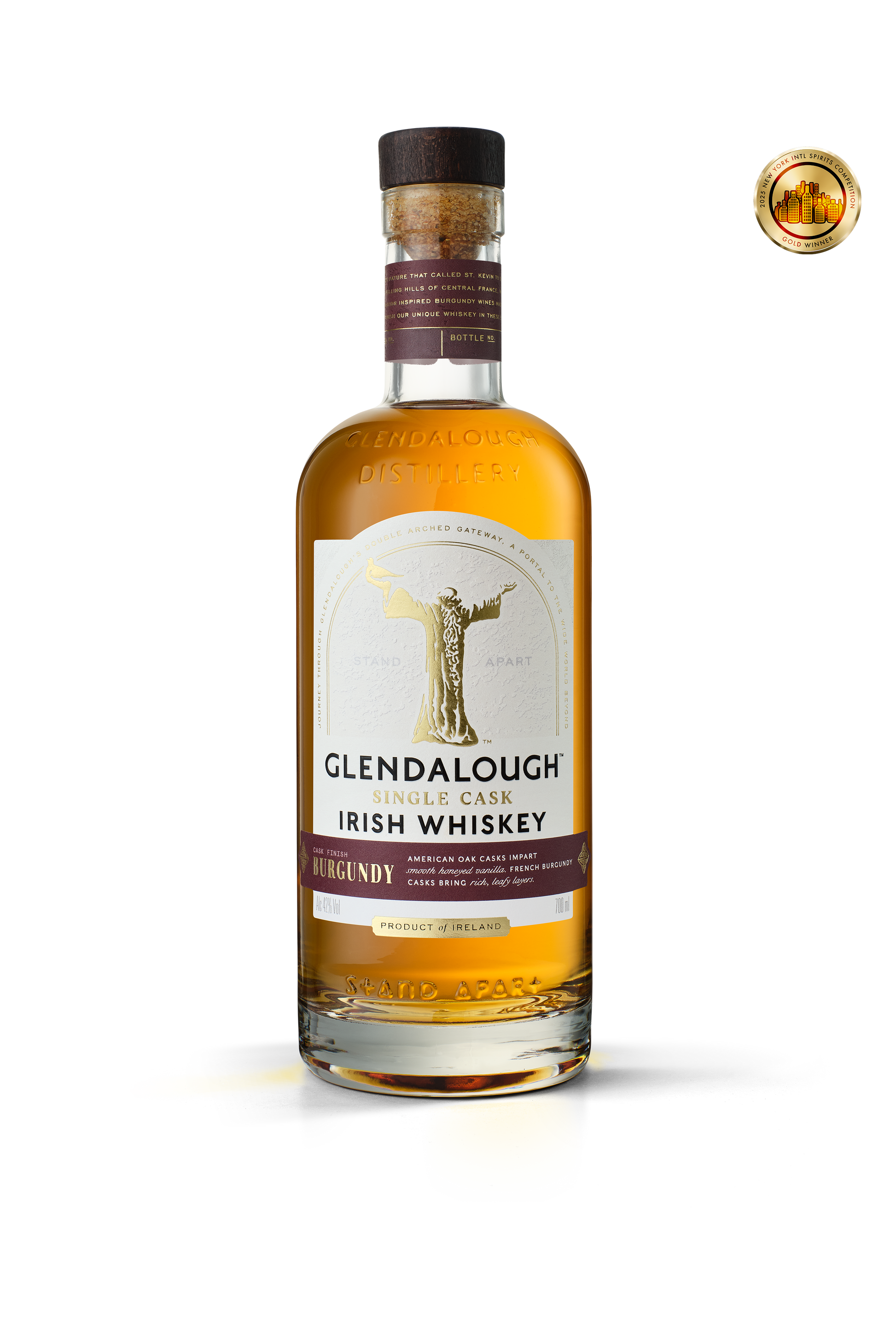 A bottle of Glendalough Single Cask Burgundy Finish Irish Whiskey with a dark wood cork and a gold award seal in the top right corner.