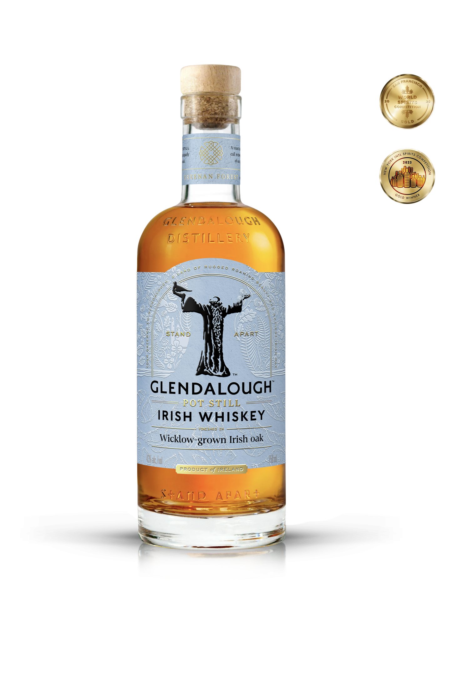 A bottle of Glendalough Pot Still Irish Whiskey with a cork stopper, featuring a gold emblem on a white textured label and two gold award medals in the top right.